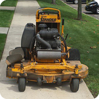 Landscape maintenance stand behind commercial lawn mower
